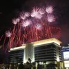 Kicking off the grand-opening celebration of Aliante Station Casino and Hotel in November 2008, colorful fireworks illuminate the northern sky above hundreds of spectators anxiously awaiting the doors to open.