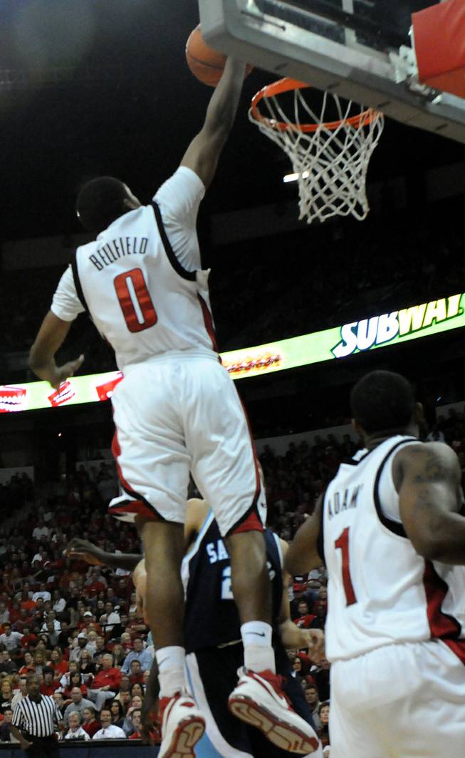 Oscar Bellfield goes up for the dunk in UNLV's opener against San Diego. The Rebels won, 65-60.