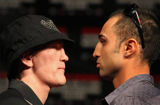 Junior welterweight boxers Ricky Hatton, (left) of Britain, and Paulie Malignaggi, of the U.S., face off during a news conference at the MGM Grand hotel and casino in Las Vegas, Nevada on Wednesday November 19, 2008. Hatton and Malignaggi will meet for a 12-round title fight at the MGM Grand Garden Arena on November 22.