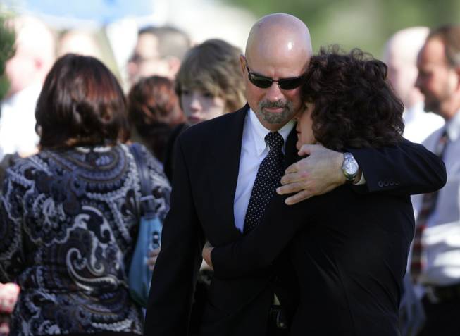 Mourners embrace at the Wednesday funeral of Olivia "Lynn" Brandise Hyten. Brandise Hyten, 15, was killed in a rollover car crash early Saturday morning.
