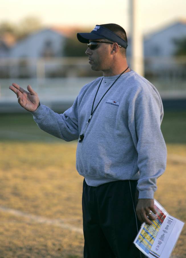 Meadows football coach Frank DeSantis observes his team during a recent practice.