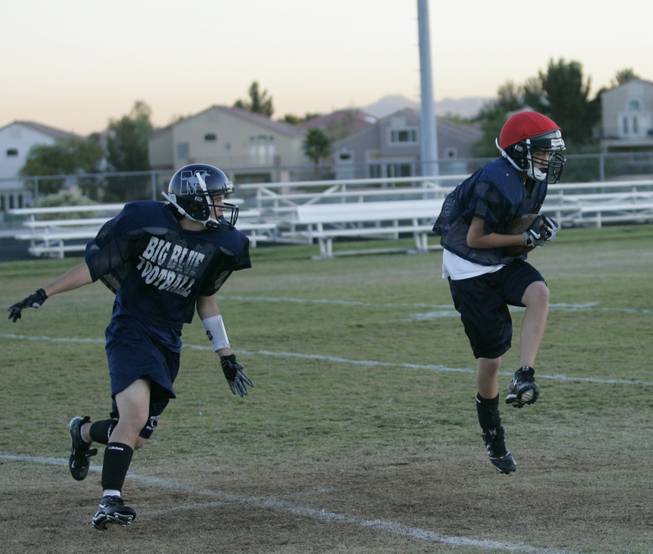 The Meadows receiver Richard Lee, right, and Nate Gord practice Tuesday for the 2A state title game on Saturday.