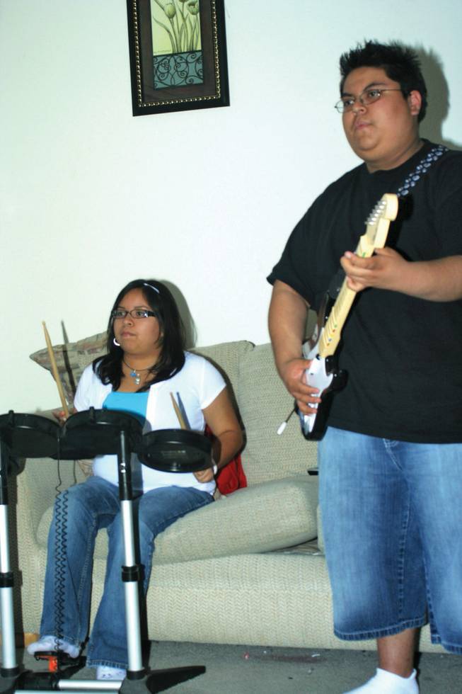 The Garcia Family was a recipient of the Adopt a Family Program put on by the Nevada Childhood Cancer Foundation. Cancer survivor Armin plays Rockband, one of the gifts they received, with his sister Ashley.