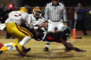 Las Vegas High School running back Raggie Bullock broke a 25-yard touchdown run with 27 seconds remaining in the game to finish off winning the Sunrise Regional title 35-28 against Del Sol at Frank Nails Field on Nov. 21.
