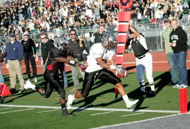 Palo Verde running back Torin Harris (5) dives for one of his four touchdowns Saturday as the Panthers trounced Las Vegas High 42-21 in the Nevada State semifinals.
