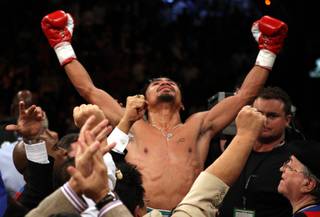 Manny Pacquiao celebrates his victory over Oscar De La Hoya after their welterweight 