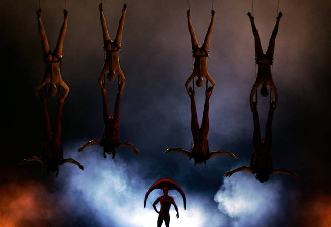Artists perform the Duo Trapeze Act during Cirque du Soleil's ...