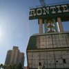 The New Frontier marquee, which stood on the Las Vegas Strip for over six decades, is disassembled by Young Electric Sign Co. (YESCO) employees and Dielco Crane Service, Inc. on Wednesday. 