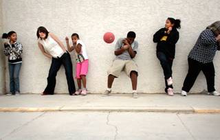 Kids and staff members play an outdoor game of dodgeball at Club Christ, an after-school program located inside the Buena Vista Springs apartment complex in North Las Vegas. From left are Paris Miller, 11, staff member Kendra Perry, Kierra Hlavacek, 10, Dezuan Fisher, 12,  Keanna Hlavacek, 12, and volunteer Linda Varela.