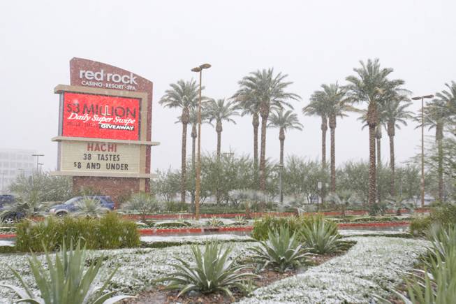 Snow dots the landscaping outside Red Rock Resort. Light snow ...