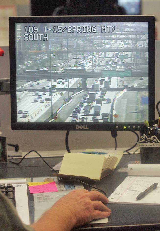 Kevin Dye, a traffic engineering technician for the RTC Traffic Operations Center, looks for accidents and traffic complications along the I-15. Henderson is preparing to test a wireless traffic signal management system that will tie into the RTC's FAST program, which manages traffic around the valley.