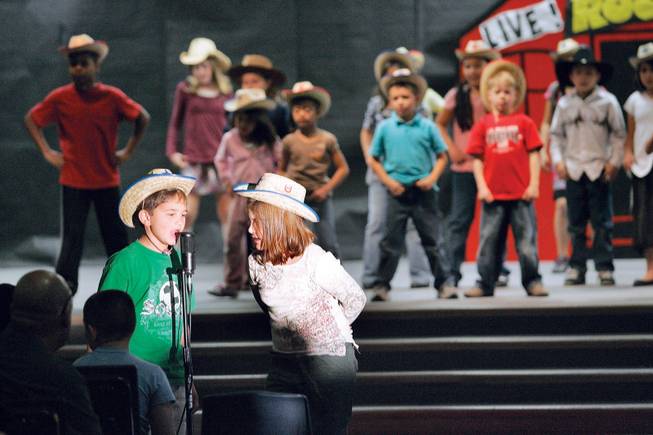 Hayes elementary third grader Collin Dodos, 8, and fourth grader Sydney O'Connor, 9, perform in "School House Rock."
