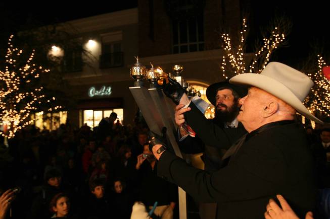 Actor Tony Curtis, right, and Rabbi Mendy Harlig of Chabad of Green Valley take part in a ceremonial menorah lighting Tuesday, Dec. 23, 2008, at The District at Green Valley Ranch in Henderson. The event was presented by Chabad of Green Valley, Congregation Ner Tamid and Midbar Kodesh Temple.
