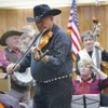 W.D. Sorensen of Ever Wednesday plays fiddle at City Hall during last year's First Night in Boulder City. This year, the Senior Center will be the venue for music.