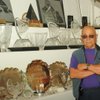 Mike Agassi poses in front of his son's, Andre, vast array of trophies.