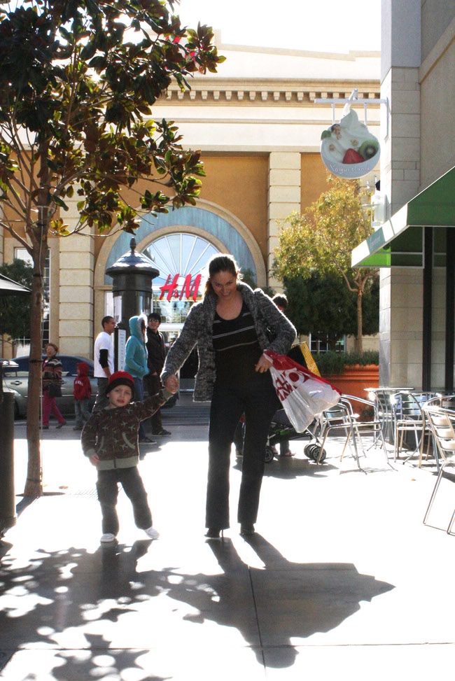 Nearby residents Sarah Raiter, right, and son, Koby, browse Town Square for some after Christmas deals.
