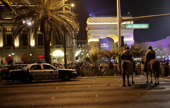 Police patrol the Strip near the Paris Las Vegas on New Year's Eve.