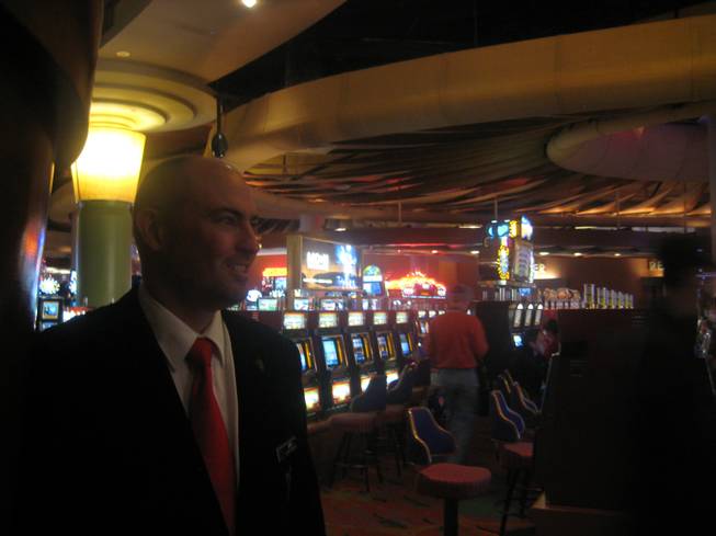 
<p>7:45 p.m.: Playboy Club floor supervisor Jeff Dwyer enjoys the relative calm of the Palms casino floor before heading up to the mayhem of his work environment.</p>

<p>As floor supervisor at Playboy Club he knew he had a long night ahead of him.</p>

<p>"We have a lot of fun, a lot of special guests like to make it to Playboy Club on New Year's Eve," he said. "It gets pretty crazy around midnight."</p>

<p>As he prepared for his 8 p.m. shift, the crowds of party people he would be corralling later that night were also just getting started.</p>