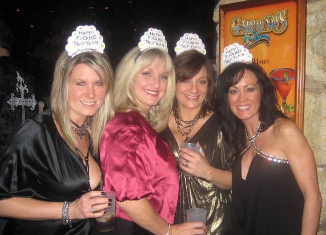 
<p>8:50 p.m.: Four mothers, no children: These women left their nine kids at home and flew to Las Vegas with their husbands to ring in the new year at the Palms.</p>

<p>Cyndi Johnston, Cyndee Fiorillo, Kristine Richter and Renee Johnston (l-r) agreed that New Year's Eve is a night for adults.</p>

<p>Between the four of them they have nine children between the ages of four and 16 years old - yet none of the women appeared to be suffering from any separation anxiety as the group made their way to their table at Gardunos.</p>

<p>Instead, the women said their only regret was that a fifth friend had to stay back home in Minnesota with her four kids while her husband accompanied the others on the trip to Sin City.</p>
