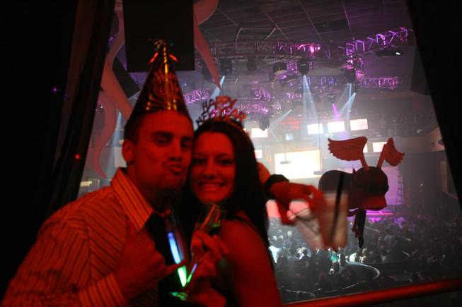 
<p>11:55 p.m.: Kale Durocher, left, and Cassi Carington, right, came to Las Vegas from sun-drenched Hawaii to celebrate New Year's Eve together at Rain. Both said they are "huge" fans of Perfecto DJ Paul Oakenfold.</p>

<p>"It was a surprise Christmas present for me to come to Vegas," Carington said. "(And) he loved Paul Oakenfold so I said let's go."</p>
