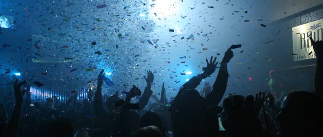 Midnight: As the cloud of confetti clears the New Year's Eve party continues at Rain.