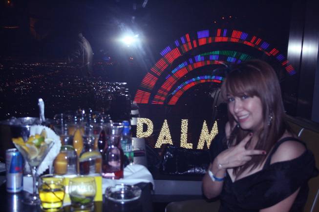 2 a.m.: A female partygoer takes a break from the New Year's Eve festivities to catch her breath and take in the breathtaking view from Moon, which is positioned on the 53rd floor of the Palms Fantasy tower. 