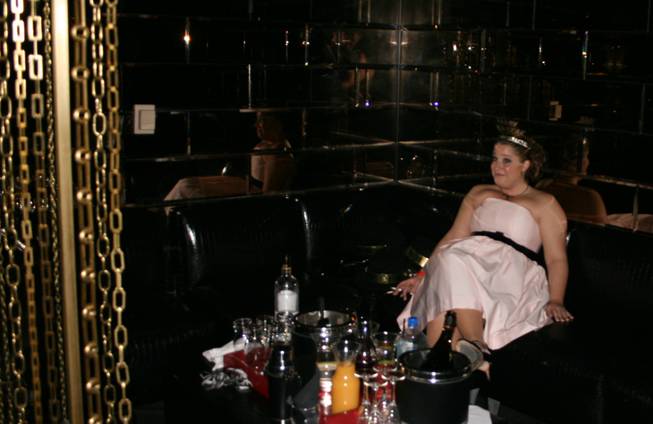 3 a.m.: A lonely party girl waits patiently at the Playboy Club as 2009 gets underway.