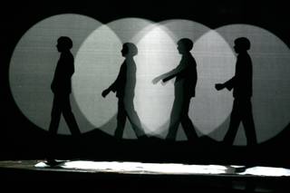 Silhouettes of the Beatles are shown during Cirque Du Soleil's Love at the Mirage Friday, Dec. 19, 2008. 