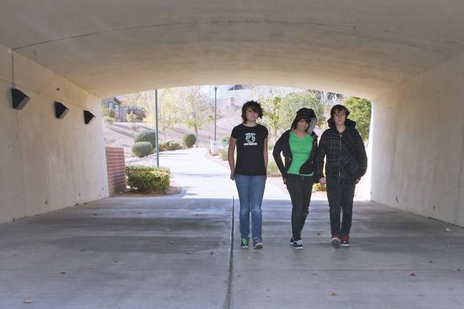 From left, Hannah Zuhse, 12, Taylor Cadnas, 13, and Toni Johnson, 14, walk the trails in Summerlin on a December morning.
