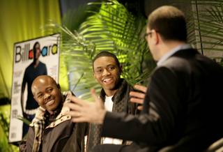 Soulja Boy (center) and his manager, Michale Croom (left), talk to Bill Werde, editorial director at Billboard magazine, about how they have used the Internet to build the Soulja Boy brand.