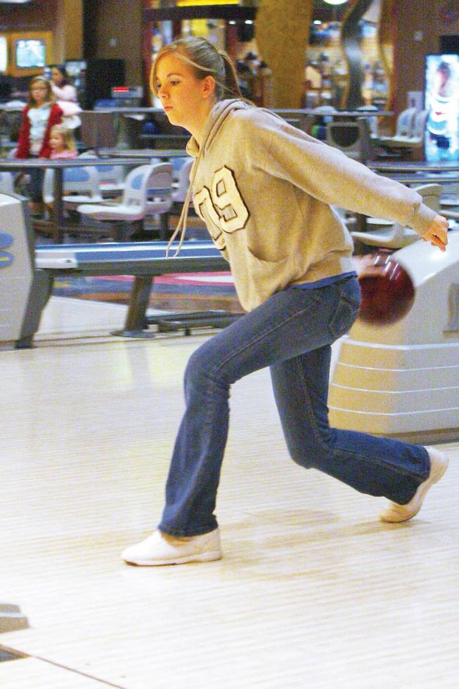 Basic bowler Shaunna Padderatz bowls during practice at Sunset Station Strike Zone bowling lanes.