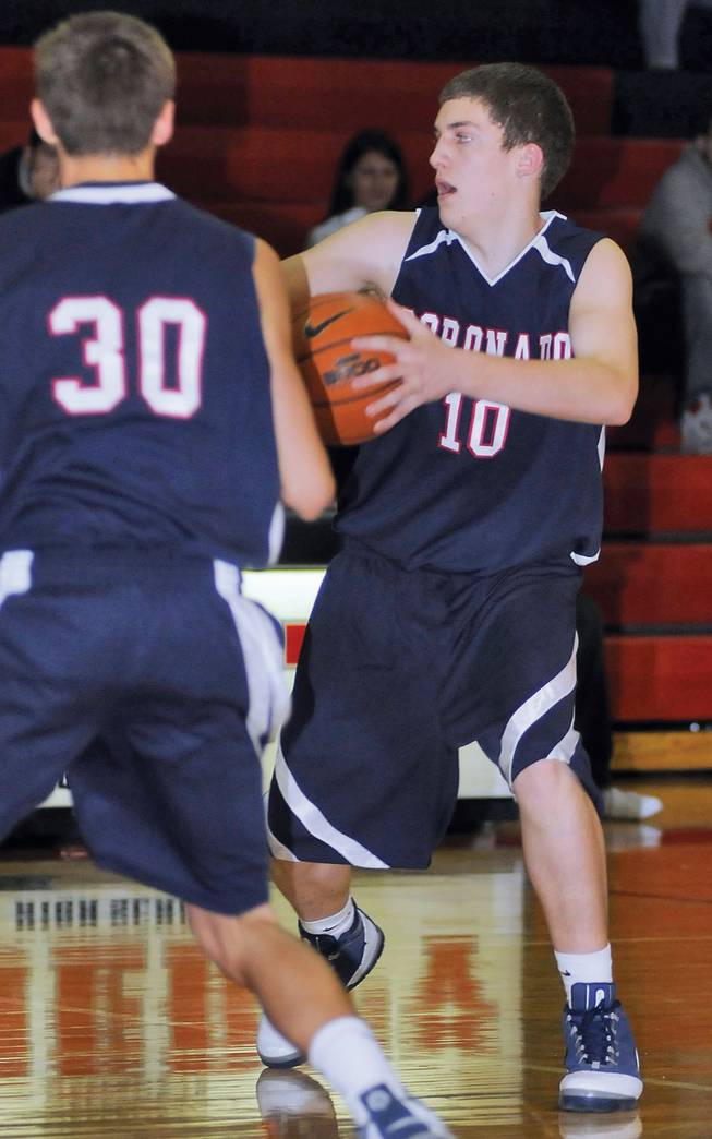 Coronado sophomore Adam Schmitt (10) takes a pass from a teammate during a game against Liberty on Dec. 16.