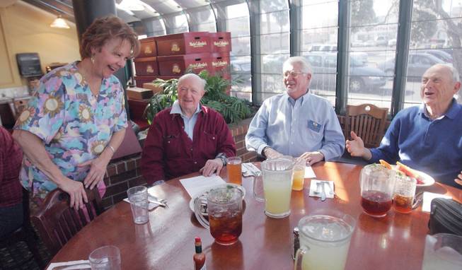 From left to right, Dr. Marcia Tinberg, president of Kiwanis of Las Vegas, talks with Kiwanis members, Daniel Mance, Tommy Thompson and Dr. Bill Scheer during their meeting at Marie Calendar's on Jan. 7.