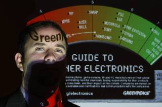 Casey Harrell, international toxics campaigner for Greenpeace, poses during a press conference on 