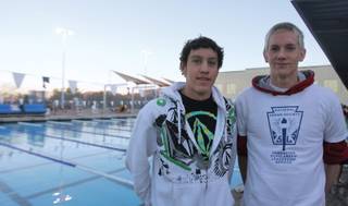 Robert Hommel, left, and Zane Grothe pose for a picture at the beginning of Boulder City-Henderson Heatwave's swim practice at the Henderson Multigenerational Center on Wednesday. Hommel and Grothe are two of 30 male swimmers chosen to attend USA Swimming's National Select Camp.