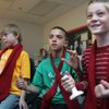 From left to right, Marshall Peterson, 9, Braydon Lopez, 10, and Hunter Huber, 9, get excited as they answer a question while playing Presidential Jeopardy in their Gifted and Talented class on Friday. The boys will be part of a group traveling to Washington, DC with for the presidential inauguration.