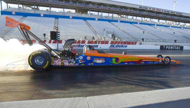 Drag racer and Boulder City resident Duane Shields does a burnout before making a run in his top alcohol dragster during the Blast-off Open Test Session at the Las Vegas Motor Speedway on Sunday.
