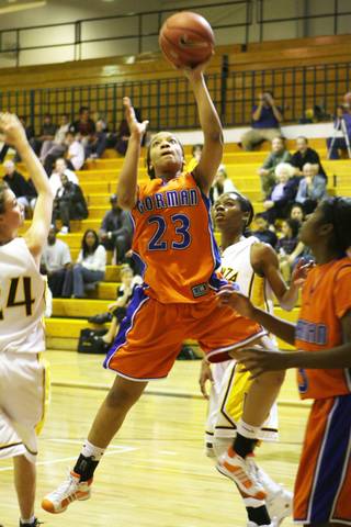 Bishop Gorman guard Yahindra Edwards goes for the basket against the Bengals at Bonanza High School on Tuesday.
