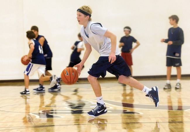 Tanner Howell dribbles the ball across the court during Elton M. Garrett Middle School's basketball practice.