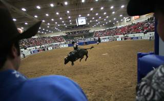 Cooper Kanngiesser of Zenda, Kan., competes during the Championship Bull Riding competition Friday at the South Point.
