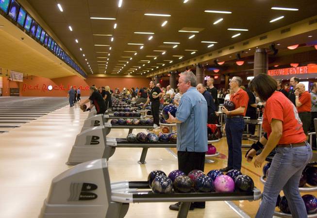 Amateur bowler Arnie Altman, center, waits for his turn during the H&R Block Tournament of Champions pro-am tournament, Saturday, Jan. 24, 2009, at Red Rock Lanes.