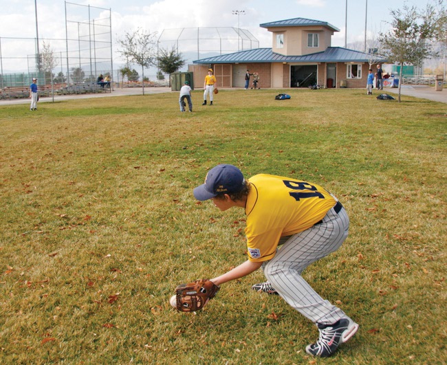 Boulder City Little League player Ian West, 13, warms up before Little League tryouts at the Veteran's Memorial Park.