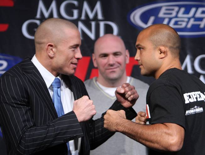 UFC welterweight champion Georges St. Pierre, left, of Montreal, Quebec, Canada faces off against lightweight champ B.J. Penn of Hilo, Hawaii during a news conference for their megafight on Jan. 31, 2009 at the MGM Grand. The two champions will have signature UFC gyms built in their hometowns.