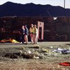 Officials confer at the scene of a fatal tour bus accident Jan. 30, 2009, on U.S. 93 near Dolan Springs, Ariz. Police said at least seven people died. The bus, carrying a Chinese tour group, was northbound toward Las Vegas before the crash.