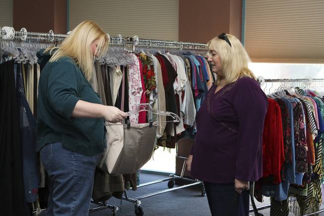 After undergoing weight-loss surgery, daughter and mother, Tanya Wersin and Rita Martin, right, shop for smaller clothing during the clothing exchange event at the Gastric Band Institute of Las Vegas Jan. 30.