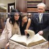 Dave Bauman shows a 1493 edition of "Nuremberg Chronicle" to Anastasia, left, and Claudia Soare of Los Angeles at Bauman Rare Books, in the Shoppes at the Palazzo. The item, one of the oldest printed books and an exemplar of early publishing, is priced at $150,000. 