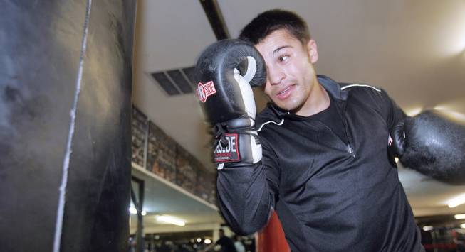Bradley Blankenship, a UNLV student and boxer, pounds the punching bag while he trains at Elite Boxing Gym.  Formally a skilled football player for Sierra Vista, Blankenship gave up the sport to pursue boxing.
