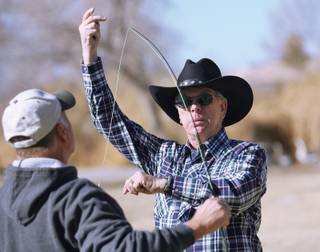 Steve White, certified fly fisherman with the Federation of Fly Fishers, demonstrates how to cast a fishing rod during a free fly fishing program at Floyd Lamb State Park on Jan. 31.






