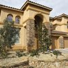 Once valued near $800,000, this 3,903-square-foot Seven Hills home was purchased while in foreclosure by Gorden and Ming Chu for $480,000. The Chu's exterior renovation included new paint, accent stone facings and xeriscape landscaping. 