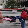 Construction workers prepare to hoist an evergreen tree and American flag atop the South Tower at the Hard Rock Hotel and Casino Friday morning. The topping off was a milestone in the resort's $750 million expansion project. 